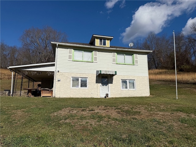 back of house featuring a yard