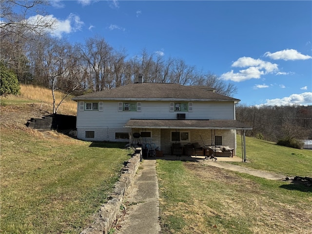 back of house with a lawn and an outdoor living space