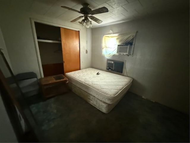 bedroom with a closet, a wall mounted air conditioner, ceiling fan, and cooling unit