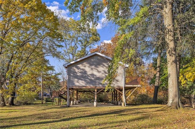 exterior space with a yard and a wooden deck