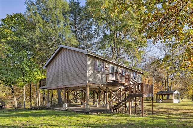 rear view of house featuring a yard