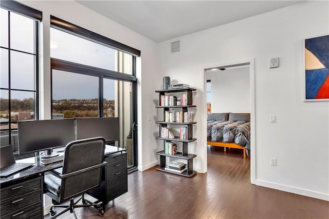 office with dark wood-type flooring