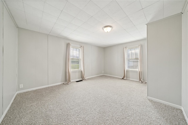 unfurnished room with light colored carpet