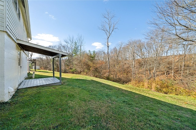 view of yard featuring a wooden deck