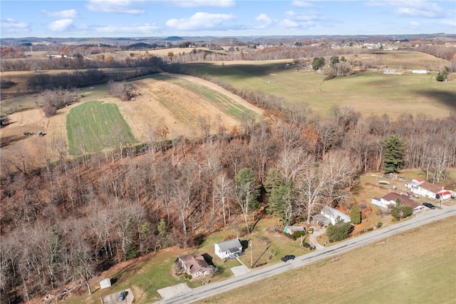 birds eye view of property with a rural view