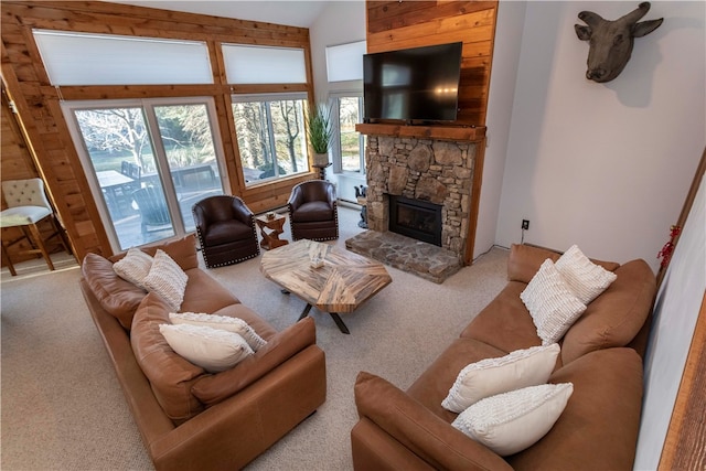 living room featuring light colored carpet, a fireplace, and vaulted ceiling