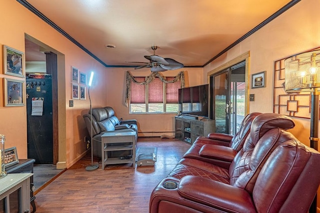 156 Sundust Rd, Nottingham, PA 15330 - living area with ornamental molding, wood finished floors, plenty of natural light, ceiling fan, and a baseboard radiator