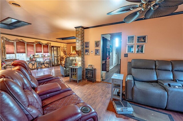 156 Sundust Rd, Nottingham, PA 15330 - living room with a wood stove, a ceiling fan, wood finished floors, ornamental molding, and baseboards