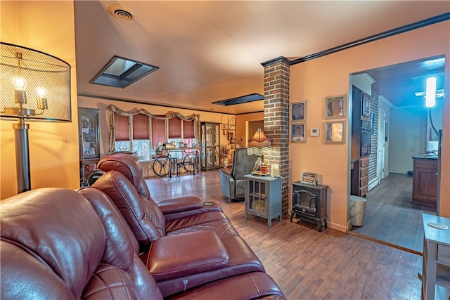 156 Sundust Rd, Nottingham, PA 15330 - living room with a wood stove, wood finished floors, decorative columns, baseboards, and crown molding