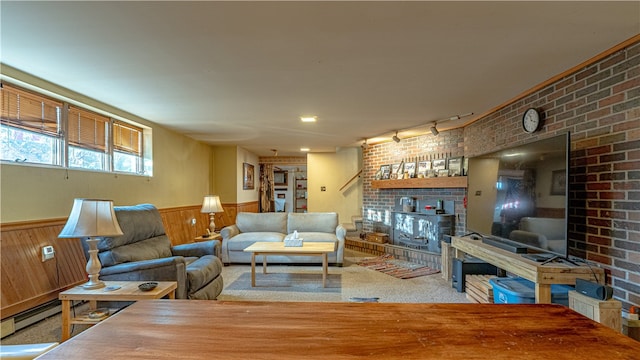 156 Sundust Rd, Nottingham, PA 15330 - living area featuring wainscoting, a fireplace, track lighting, wood walls, and brick wall