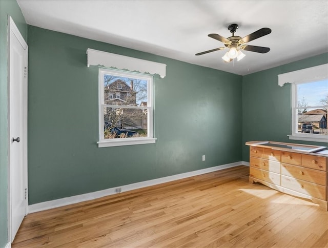 interior space with ceiling fan and light wood-type flooring