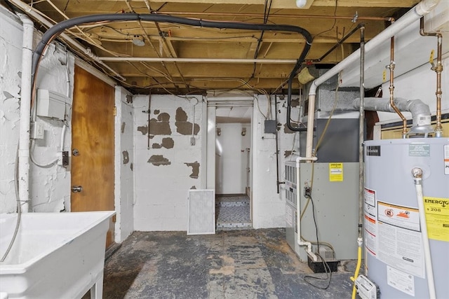 basement featuring heating unit and gas water heater