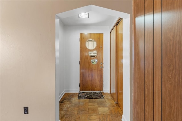 entryway featuring parquet floors