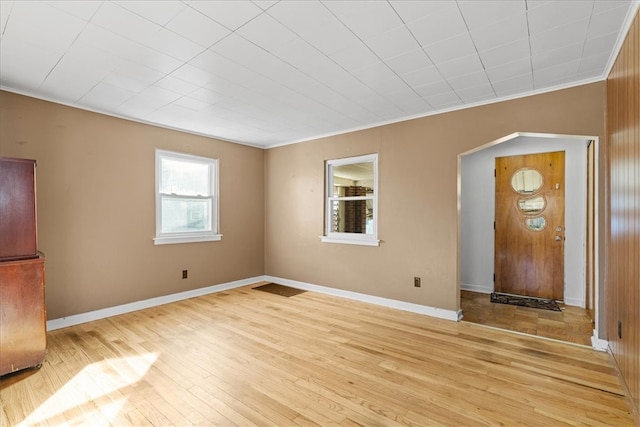 entrance foyer with light hardwood / wood-style floors and ornamental molding