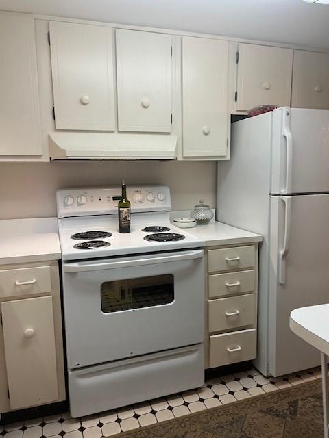 kitchen with white cabinets and white appliances