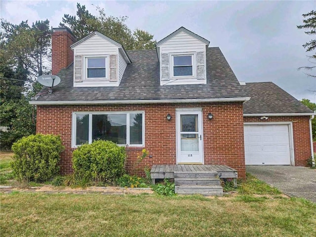 115 Mountain View Dr, E/W Wheatfield Twp, PA 15920 - cape cod-style house featuring brick siding, a chimney, a front lawn, and a garage