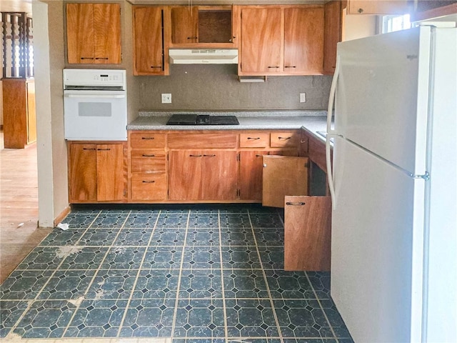 kitchen with white appliances and tasteful backsplash