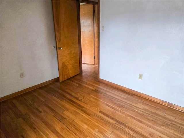 unfurnished room featuring hardwood / wood-style floors