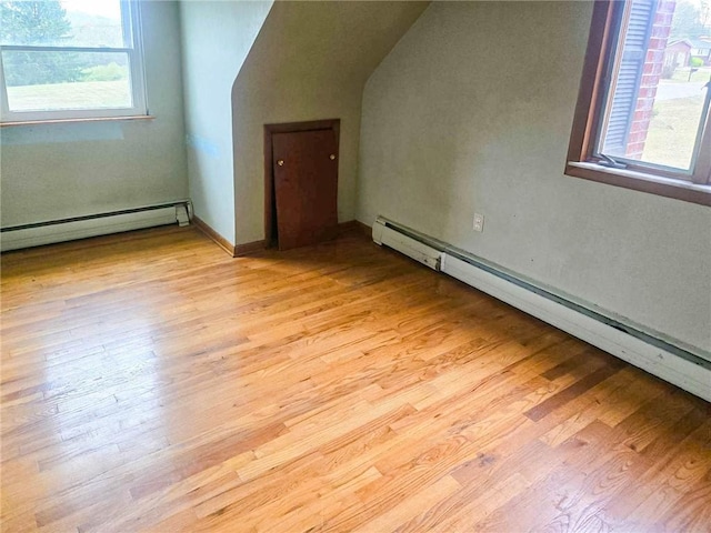115 Mountain View Dr, E/W Wheatfield Twp, PA 15920 - additional living space with a baseboard radiator, a baseboard heating unit, plenty of natural light, and light wood-style flooring
