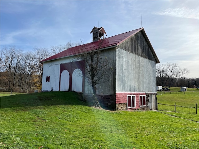 view of outbuilding with a lawn