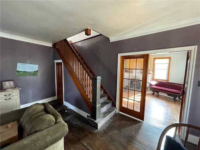 stairway with hardwood / wood-style floors and ornamental molding