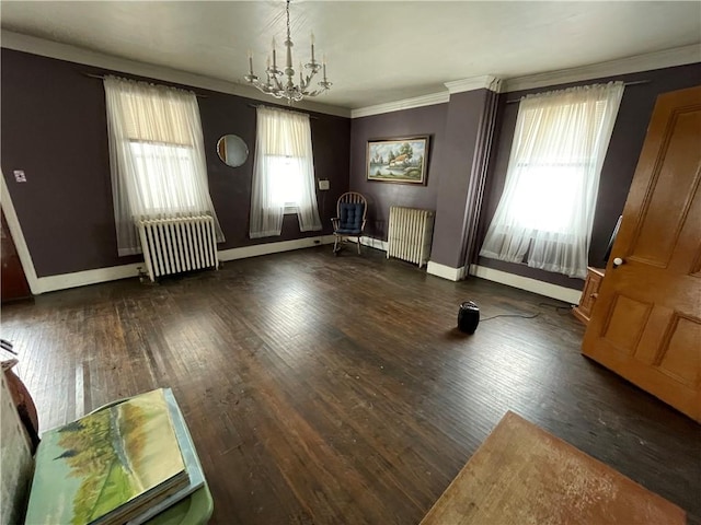 interior space featuring radiator heating unit, an inviting chandelier, and a wealth of natural light