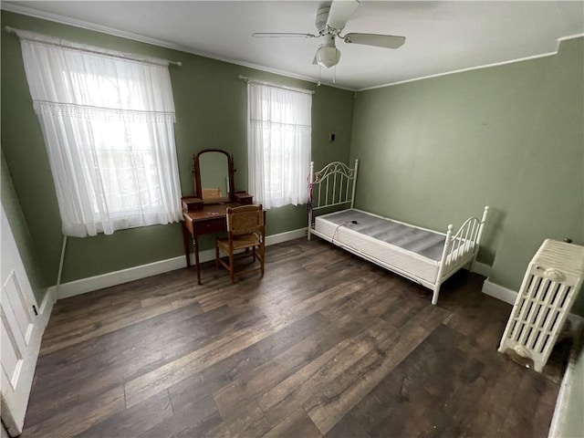 bedroom with dark hardwood / wood-style flooring, multiple windows, crown molding, and ceiling fan