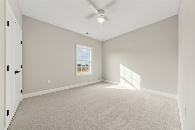 unfurnished bedroom with light carpet and ceiling fan