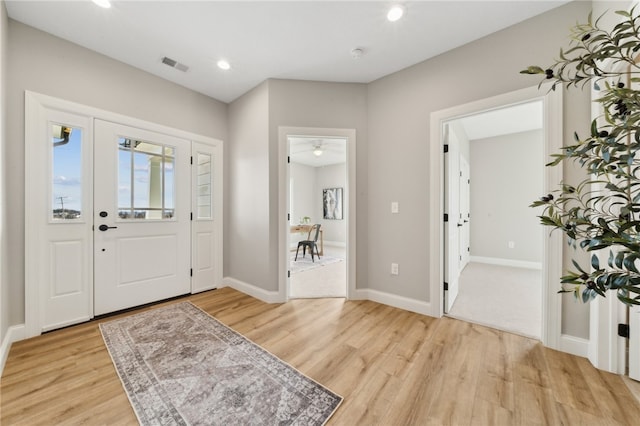 entryway with light hardwood / wood-style floors