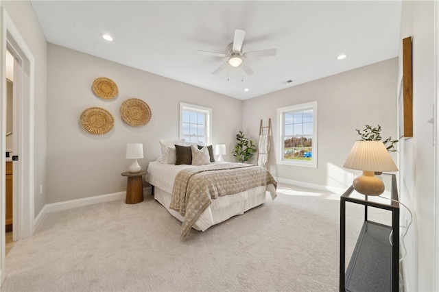 bedroom with ceiling fan and light colored carpet