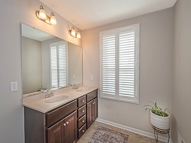 bathroom with tile patterned flooring and vanity