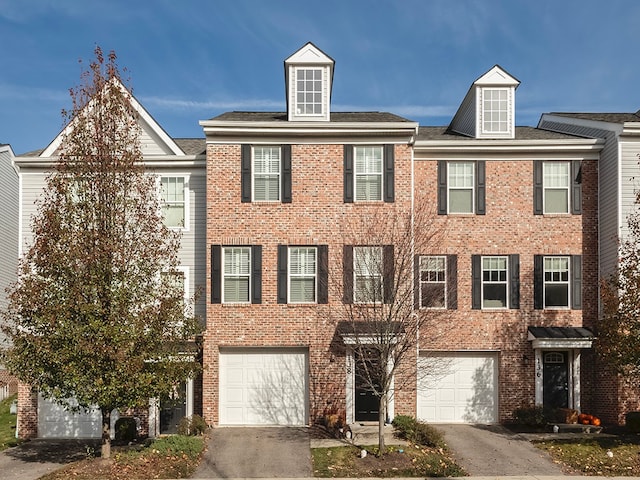 multi unit property featuring a garage