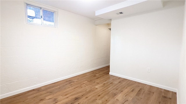 basement featuring wood-type flooring