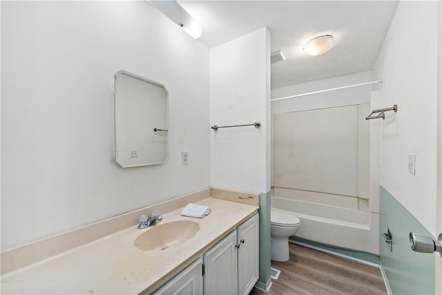 full bathroom featuring shower / bath combination, vanity, hardwood / wood-style flooring, and toilet