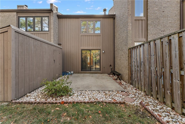 property entrance featuring a patio