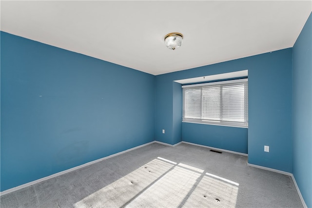 spare room with light colored carpet