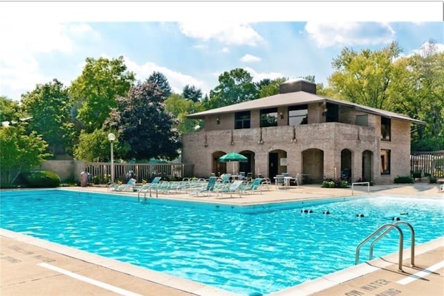 view of swimming pool featuring a patio area