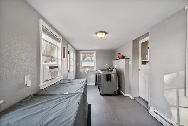 laundry room featuring independent washer and dryer, baseboard heating, and cooling unit