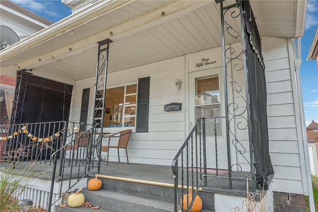 property entrance with covered porch