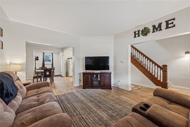 living room with light hardwood / wood-style flooring