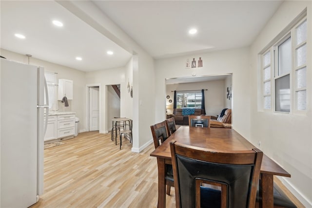 dining area with light wood-type flooring