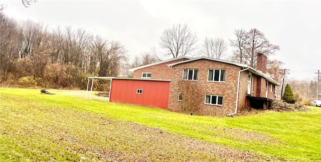 view of side of home featuring a yard