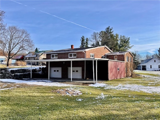 view of front of property featuring a garage and a front lawn