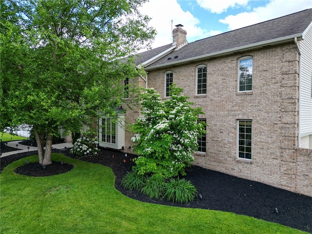 view of property exterior featuring a yard