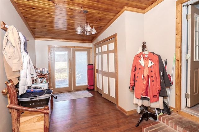 foyer entrance featuring french doors, dark hardwood / wood-style flooring, wood ceiling, a notable chandelier, and lofted ceiling