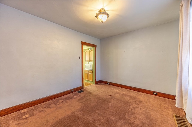 view of carpeted spare room