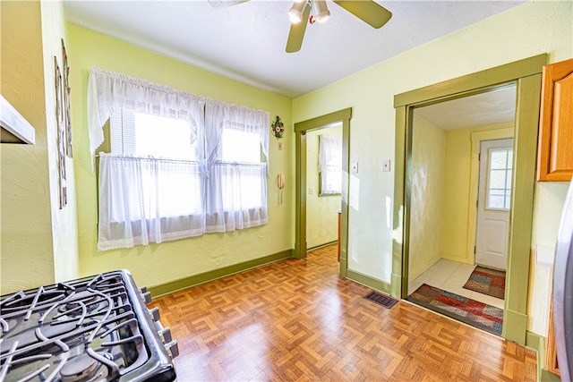 entryway with ceiling fan and light parquet flooring