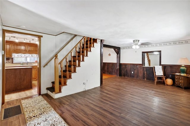 175 Long Woods Rd, Waynsbrg/Frankln Twp, PA 15370 - below grade area with wood finished floors, ceiling fan, stairway, rail lighting, and wood walls