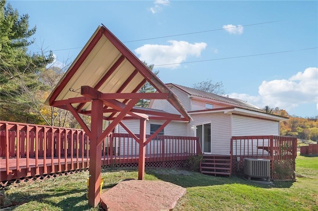 175 Long Woods Rd, Waynsbrg/Frankln Twp, PA 15370 - rear view of property featuring central AC unit, a wooden deck, a lawn, and metal roof