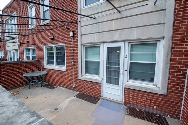 entrance to property with a patio